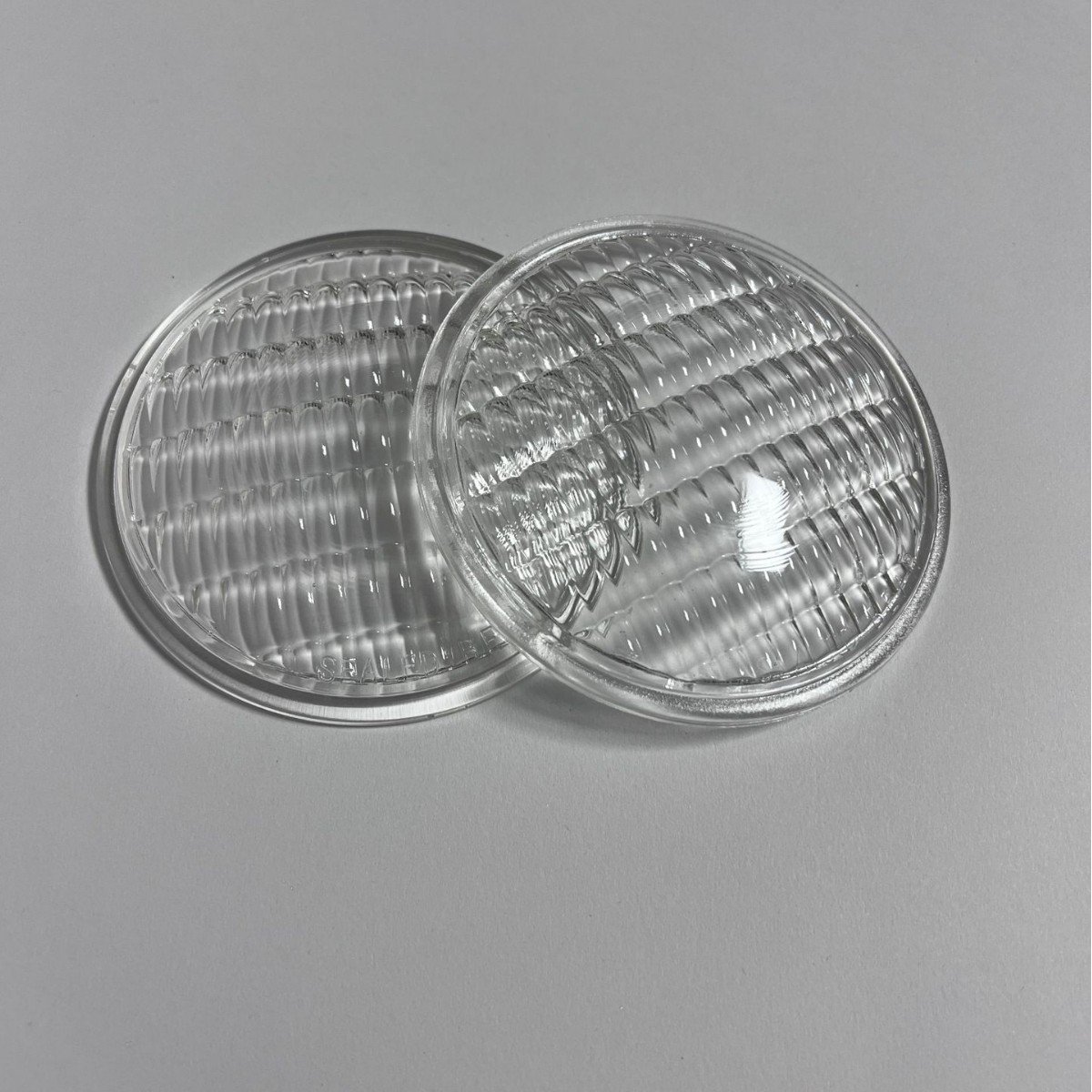 Round clear pressed glass signal light lenses with Fresnel prismatic pattern for traffic signals, railway indicators, and airfield lighting fixtures